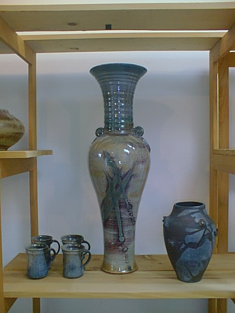 Shino-glazed tall vase with mugs