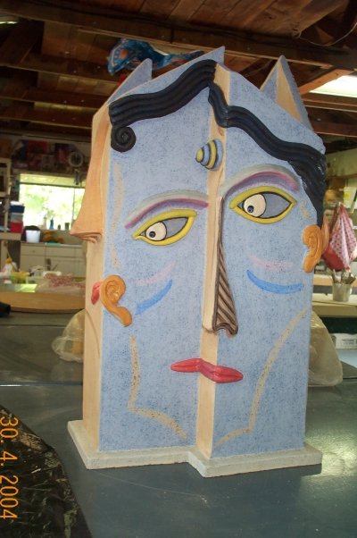 Painted face totem