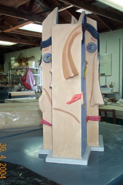 Carved face totem in progress